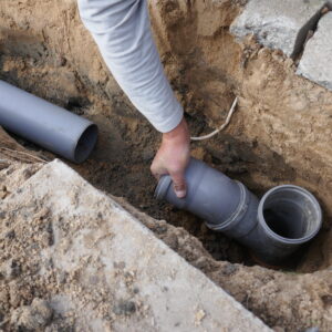 laying and installing a sewer pipe